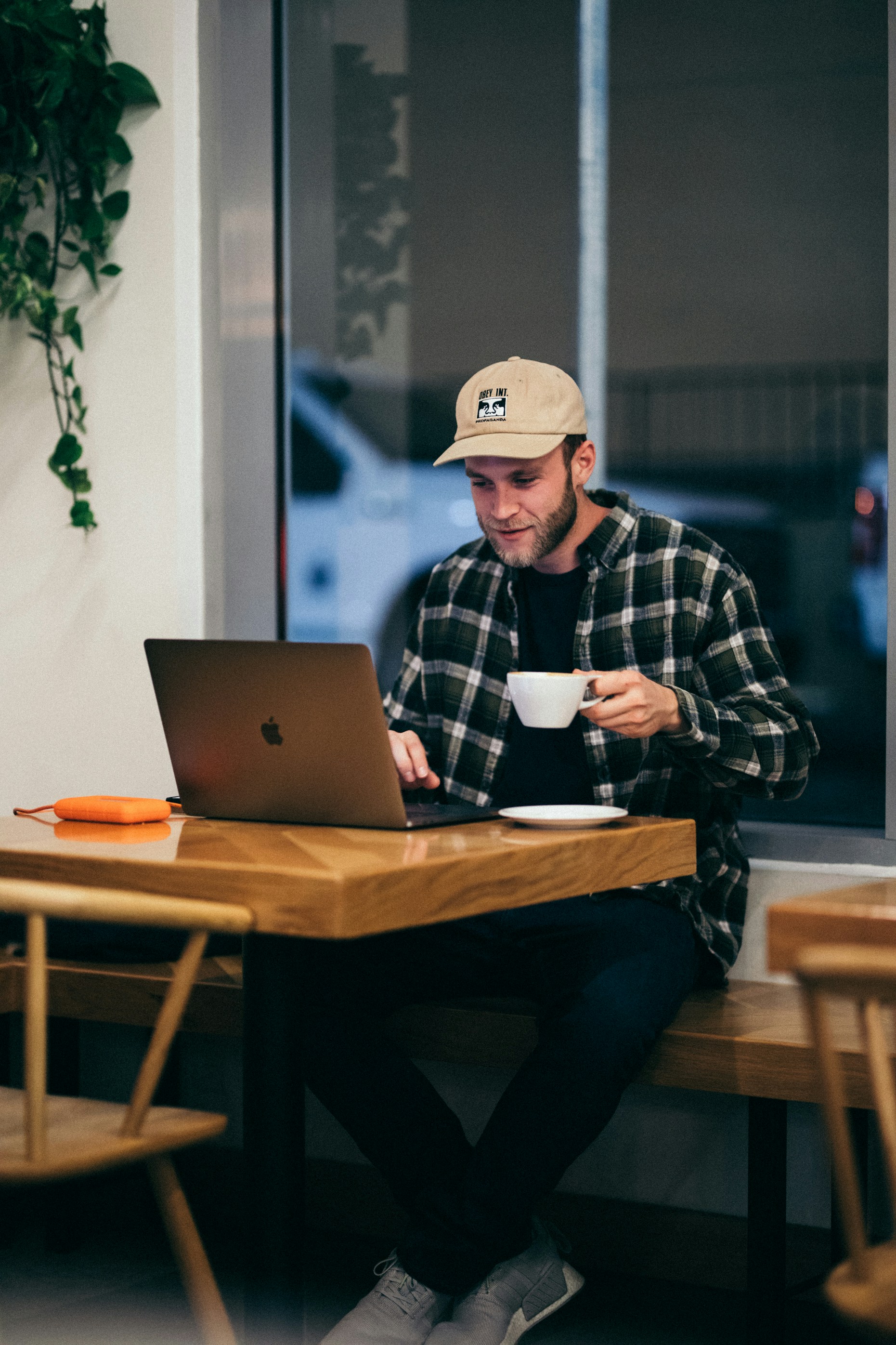 Man with a coffee at his computer